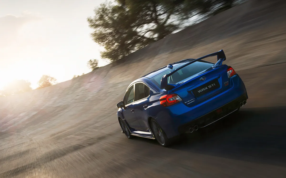 Brand video and sports video — Subaru WRX STI driving on a sunlit road